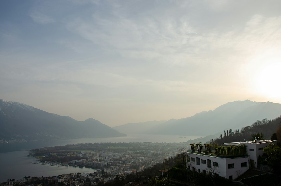 Modern luxury villa with lake and mountain view in Switzerland at golden hour