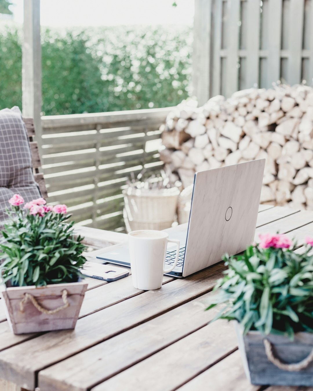 Bright modern editorial office with plants and wooden desks